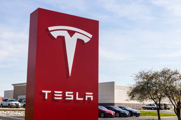Tesla Service Center. Tesla designs and manufactures the Model S electric sedan IV